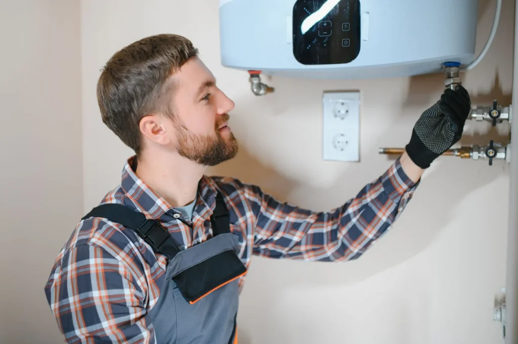 Technician inspecting a residential boiler to determine whether repair or replacement is the better option